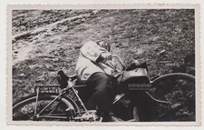 Taking Break or Pulling Prank? Cyclist Hits the Ground with Twist of Humor Photo