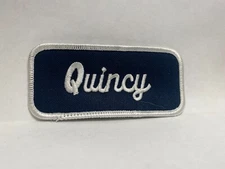 QUINCY USED EMBROIDERED VINTAGE SEW ON NAME PATCH TAGS WHITE ON DARK BLUE
