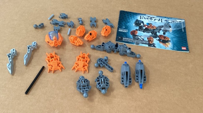 Lego Bionicle Lot, Orange And Grey Pieces Miscellaneous Lot And Booklet