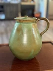 Frankoma Style Pottery pitcher with Prairie Green and brown glaze.