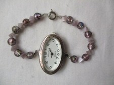 Geneva Wristwatch White Oval Shaped Face Silver Tone Purple Beaded Band