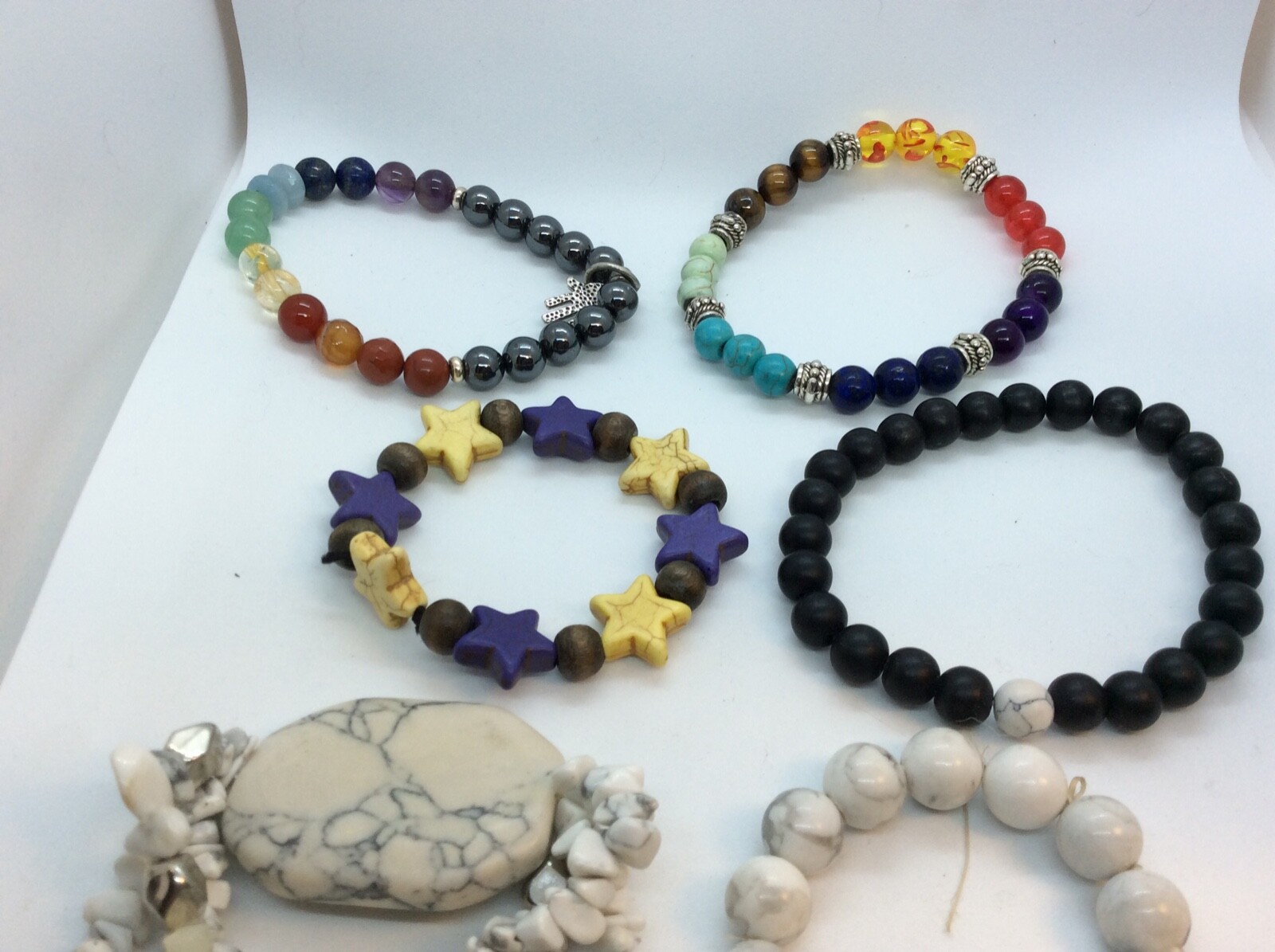 Six Howlite stone bracelets with semi-precious gemstones