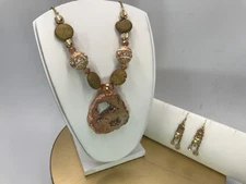 22” cable chain gold lava rock fancy bead and pink geode pendant 