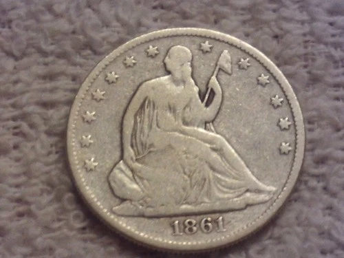 1861 seated liberty half dollar in very good condition