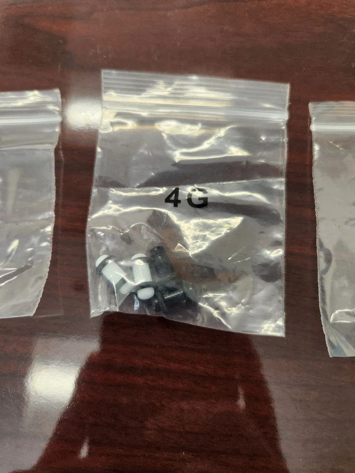 Kit de estiramiento de oreja de tabique de plástico blanco y negro de 6 g a 00 g 10 mm Foto 3 de 4