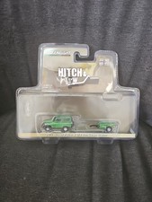 2022 Greenlight Hitch & Tow 1972 Nissan Patrol & 1/4 Ton Cargo Trailer Die-Cast
