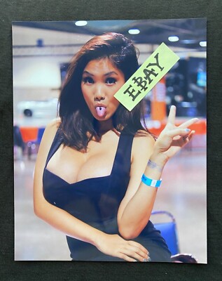 Sexy Asian Model XENA KAI photo Busty Cleavage Female tongue Peace sign