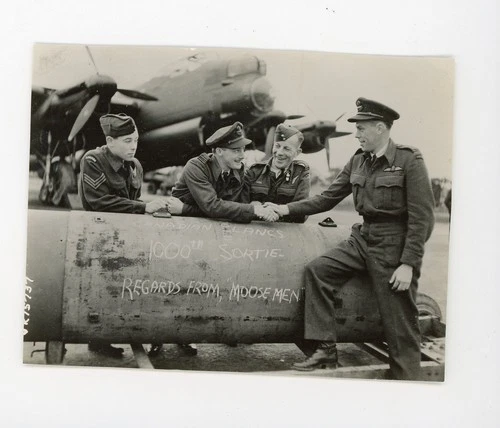 Man in uniform with bomb  Moose Men  Military vintage photo ww2 World War Two