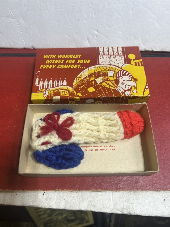 A hand-crocheted vintage novelty sock that's equal parts absurd and charming — the kind of gag gift that actually gets passed around at a party.
