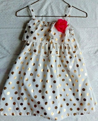 pink dress with gold polka dots