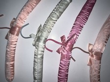 PREOWNED SET OF 4 STAIN HANGERS COQUETTE AND VINTAGE IN GOOD CONDITION