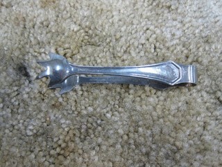 NC&StL marked silver sugar tongs.