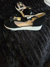 Lovely black suede shoe/ sandals with white soles and gold tassel. New with tag