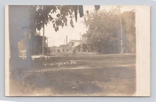 Postcard RPPC  Elm Street Dirt Road  Buildings Farmington Iowa IA