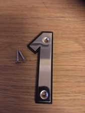 Number 1 Polished Stainless Steel on Black Plastic Background 63mm with screws