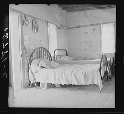 this single-room house these two beds sleep mother, three sisters brothers six