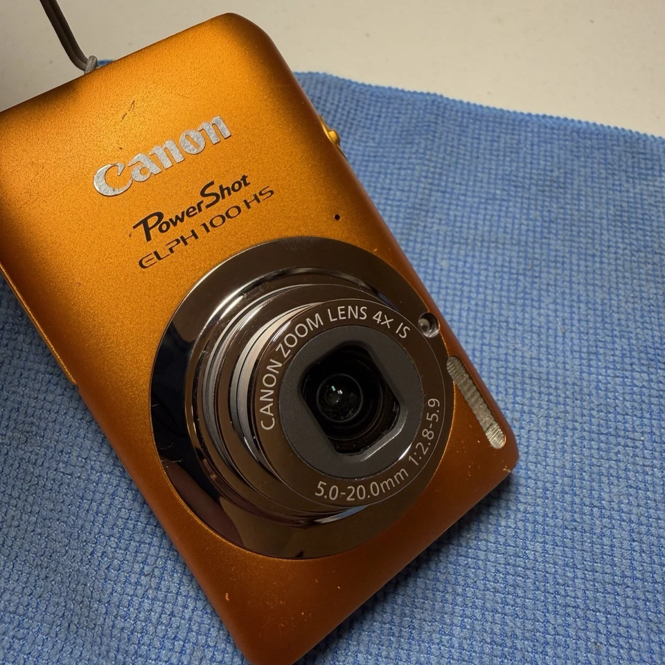 Cámara digital Canon PowerShot ELPH 100 HS 12 MP 4X zoom óptico naranja probado Foto 4 de 4