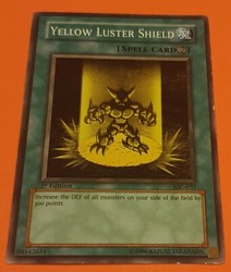 Yellow Luster Shield IOC-037 Common 1st Edition