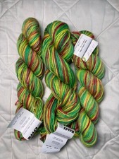 3 skeins Koigu KPPPM sock yarn in shades of green