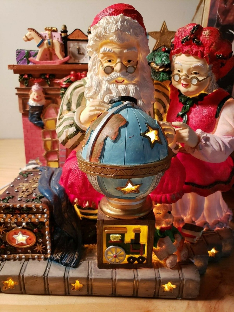 Grandeur Noel Santa Mrs Claus Fireplace Globe Musical Lighted