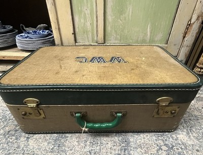 Vintage Suitcase Mid Century Travel Case WWC on the top of it