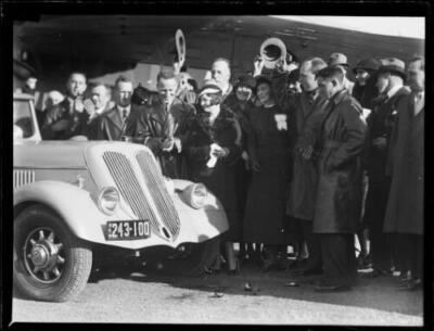 Aviator Charles Kingsford Smith admiring his specially designed ne- Old Photo
