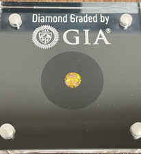 0.53 Carat Fancy Intense Orange Yellow GIA Diamond Round Natural Color Certified