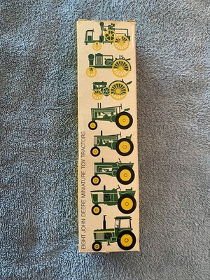 eight john deere miniature toy tractors