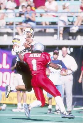 Wide receiver Marcus Harris Wyoming Cowboys focuses on the footbal- Old Photo