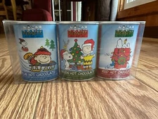 PEANUTS COLORED HOT CHOCOLATE SET OF 3 2.5 OZ FESTIVE TINS EXPIRED HK#1