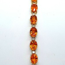 Gorgeous 5 x 7 Oval Spessartine Garnet And Diamond 14 k YG Tennis Bracelet 