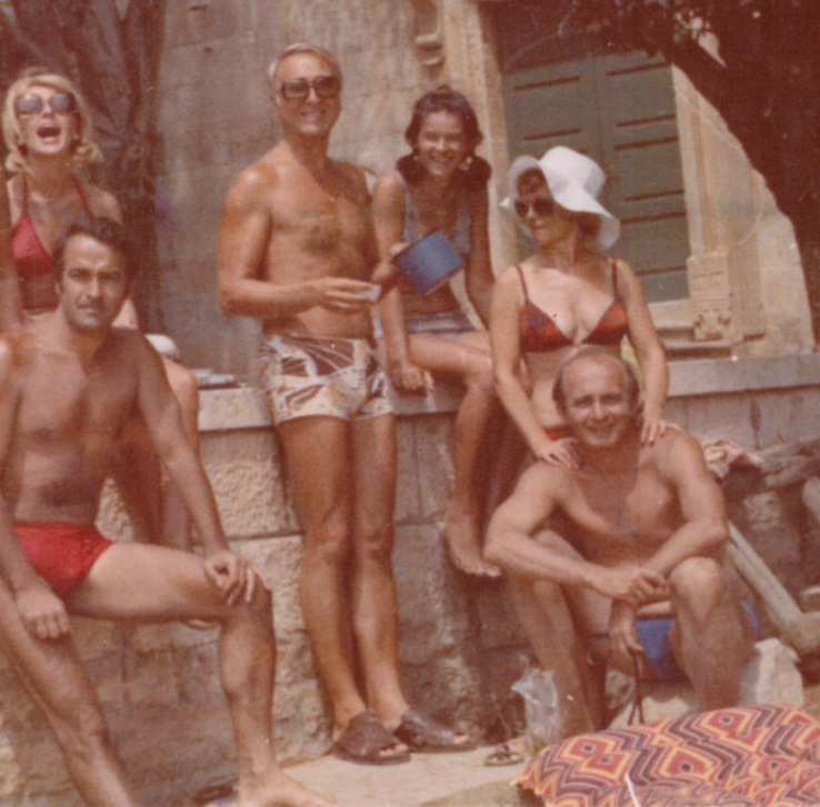 vintage-1970s-color-photo-large-group-friends-posing-beach-swimwear