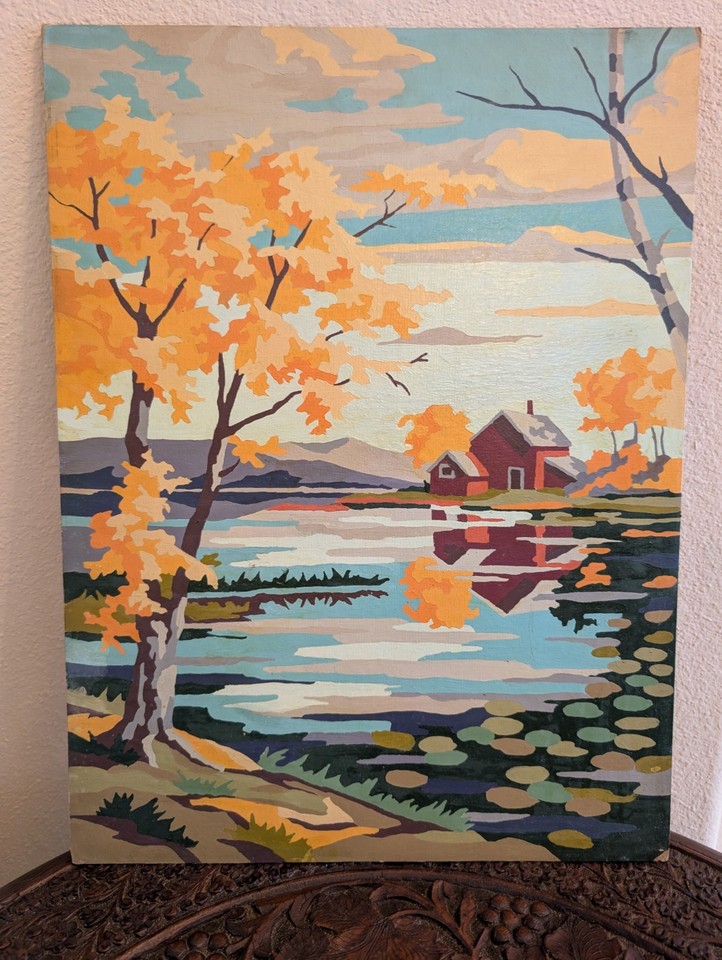 A completed vintage Paint-by-Numbers landscape — the nostalgic folk-art charm of these is having a serious design-world moment right now.