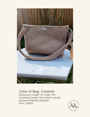 New caramel colored crochet bag that includes charm. It is also handmade.