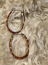 Pair of Gold Toned Hoop Earrings with Red Accent