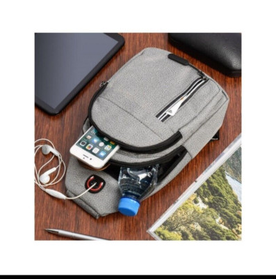 Small grey single shoulder backpack with a reflective line ideal for La Bici 