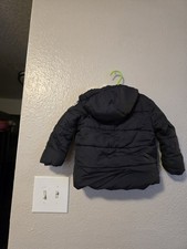 This Is a Ben Sherman boy's black hood puffer coat