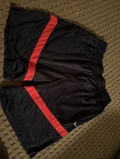 Nike basketball shorts, Black with Red stripes. Size large, Excellent condition.