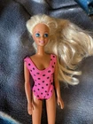 Beautiful Vintage Mattel Barbie Doll  1980s -90s wearing a pink swimsuit