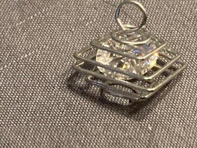 Pendant:  handmade caged 3 carat Moissanite