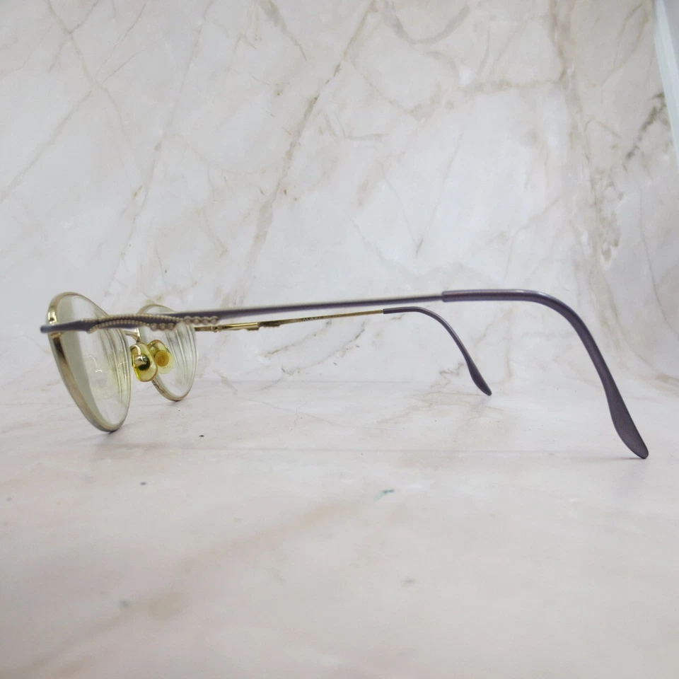 Marco de gafas Marchon 505 para mujer de metal dorado forma ovalada borde completo 54-17-135 Foto 3 de 4