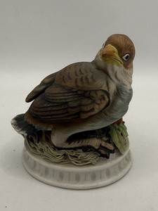 hand-painted porcelain figurine titled "Snow Bird" by Lefton
