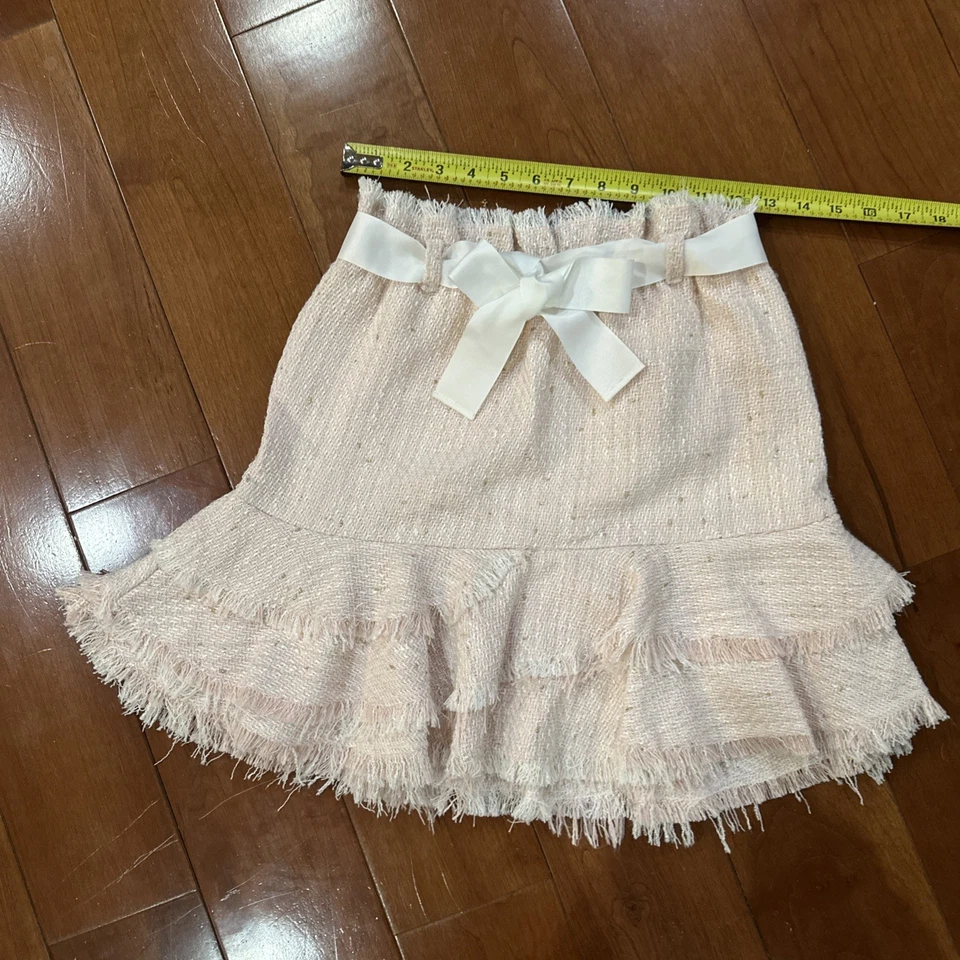 Hermosa falda de tweed rosa claro con lazo blanco Foto 3 de 4