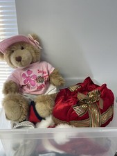 Vintage teddy bear with outfits
