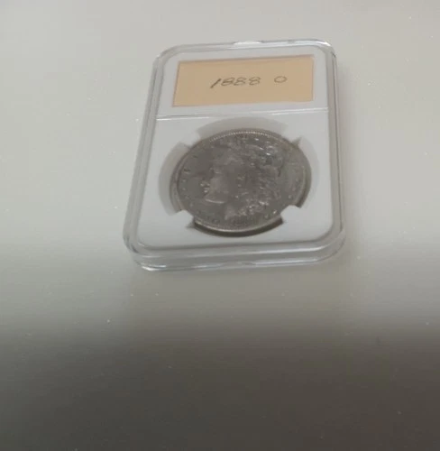 1888 O MORGAN SILVER DOLLAR, in holder, good condition.
