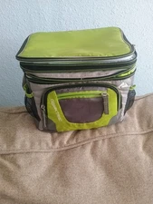 The Bag Is An Ozark Trail 6-can Soft-sided Cooler In A Gray and Green Color.