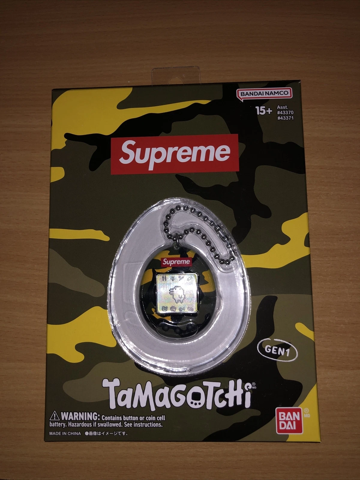 Supreme x Tamagotchi Keychain Brand New Camo in hand