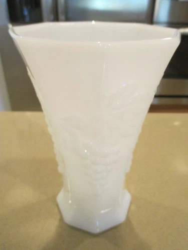 MILK GLASS VASE  2.5" TO 4.25" AT TOP 7 INCHES TALL FILL W/FLOWERS