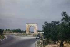 Arc De Bera Near Tarragona Spain Car drives towards the Arc de Ber- 1960 Photo