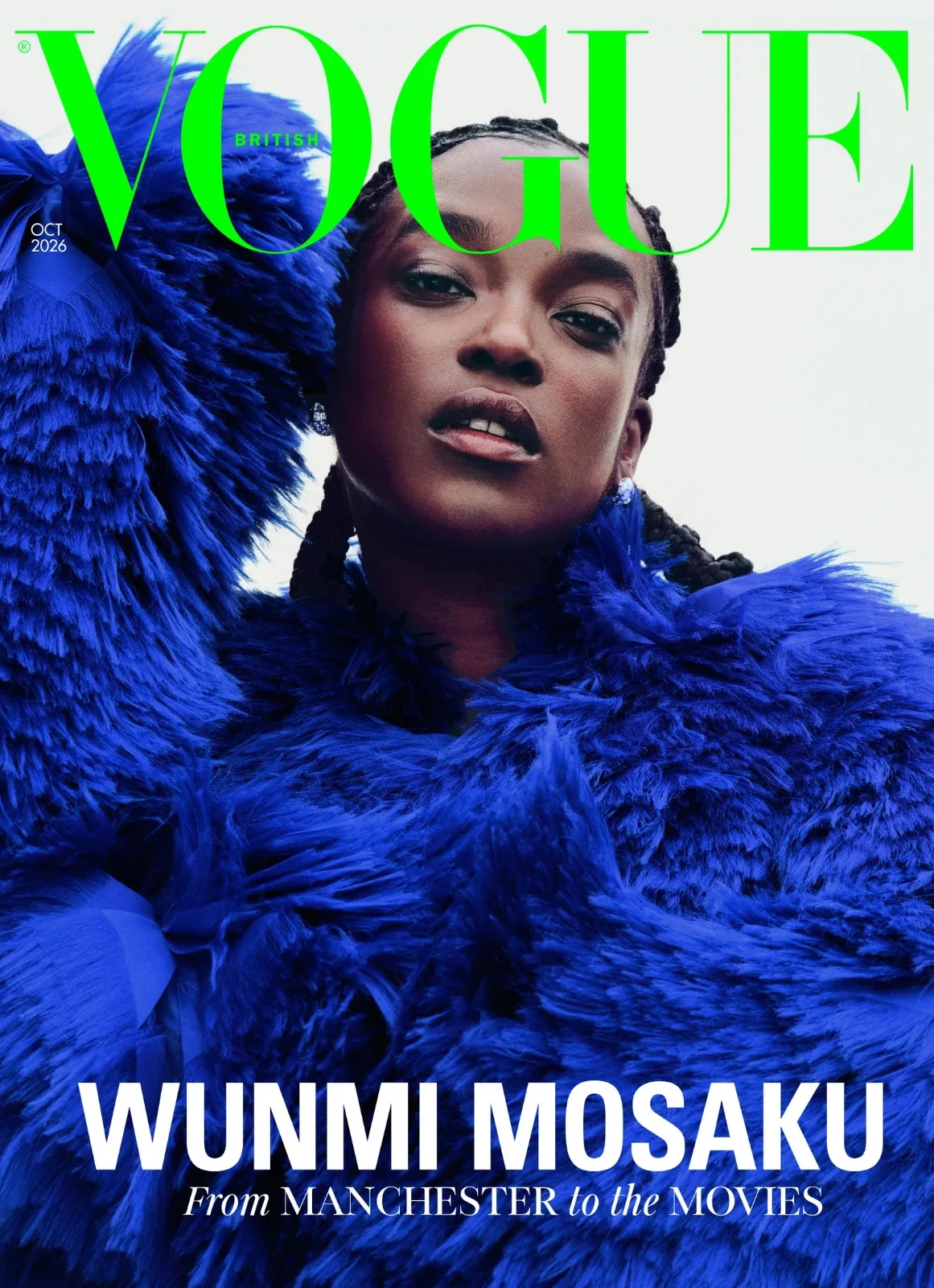 UK Vogue cover with green hair silhouette, blue and cream outfit, and text “Wunmi Mosaku from Manchester to the Movies.”